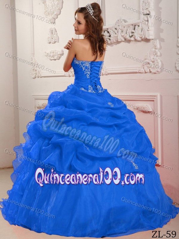 Blue Strapless Quinceanera Dress with Beading and Ruffled Skirt
