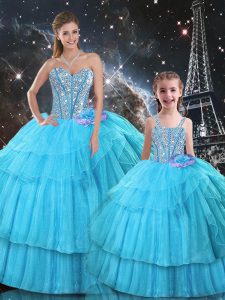 Sumptuous Aqua Blue Sleeveless Ruffled Layers and Sequins Floor Length Quince Ball Gowns