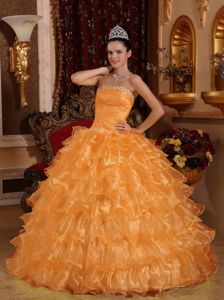 Orange Ruched Strapless Quinces Dresses with Ruffles and Beading
