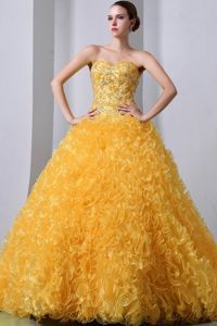 Brush Train and Beading Golden Quinceanera Dress with Heavy Tucks