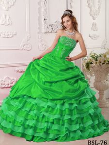 Green Strapless Sweet 16 Dress with Beading and Ruffled Layers