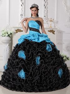 Blue and Black Sweet 15 Dress with Ruffles and Rolling Flowers